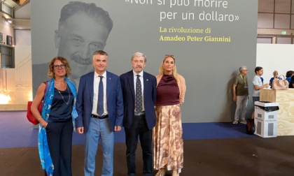 Il presidente Bucci al Meeting di Rimini alla mostra dedicata ad Amadeo Peter Giannini
